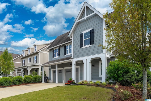 7593 Paine Dr, Trussville, AL 35173 - view of front of house featuring an attached garage, driveway, a front lawn, and a shingled roof