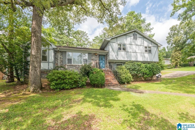 1912 Tall Timbers Dr, Hoover, AL 35226 - tri-level home featuring a front lawn and brick siding