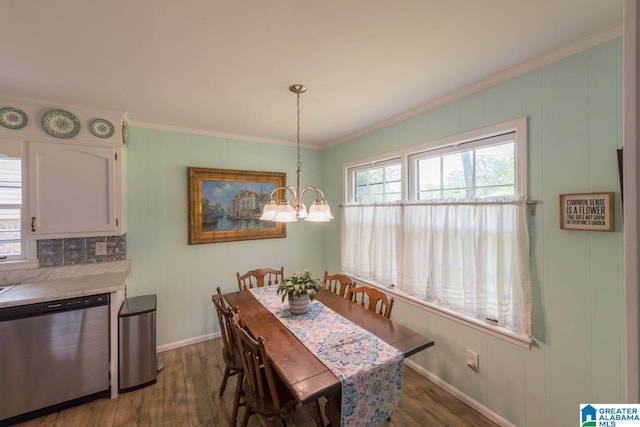 1912 Tall Timbers Dr, Hoover, AL 35226 - dining space featuring a chandelier, wood finished floors, and ornamental molding