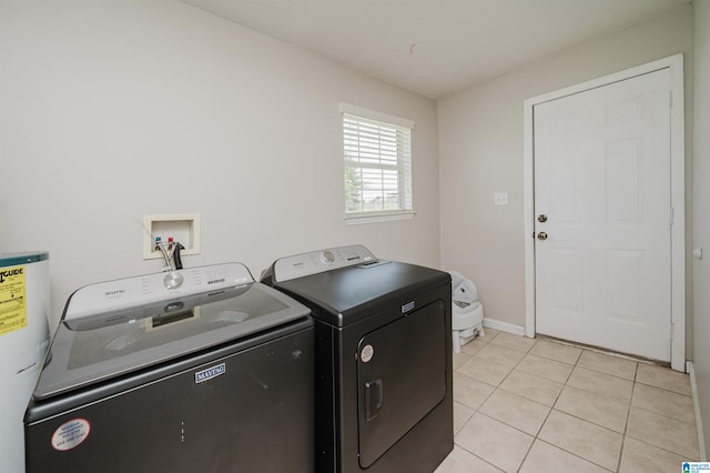2511 Black Rd, Blountsville, AL 35031 - laundry room with washer and dryer, water heater, and light tile patterned floors