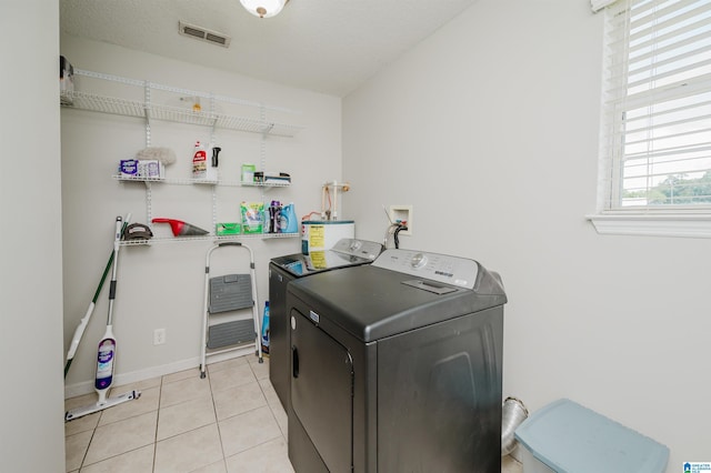 2511 Black Rd, Blountsville, AL 35031 - washroom with separate washer and dryer, tile patterned flooring, and electric water heater