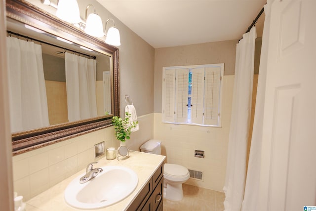 4648 Clairmont Ave S, Birmingham, AL 35222 - bathroom featuring tile walls, vanity, tile patterned floors, and wainscoting