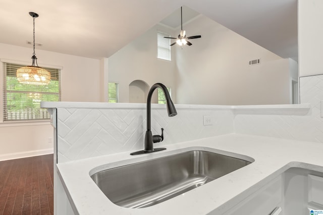 5381 Park Side Cir, Hoover, AL 35244 - detailed view of tasteful backsplash, dark wood-type flooring, hanging light fixtures, ceiling fan, and white cabinetry