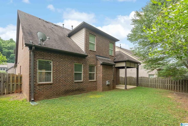 5381 Park Side Cir, Hoover, AL 35244 - rear view of property featuring a shingled roof, brick siding, a fenced backyard, and a patio