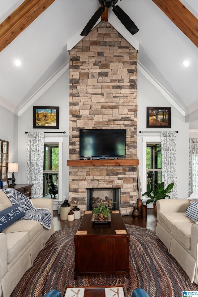 715 W Cassie Dr, Pell City, AL 35128 - living area featuring wood finished floors, high vaulted ceiling, ceiling fan, a fireplace, and plenty of natural light