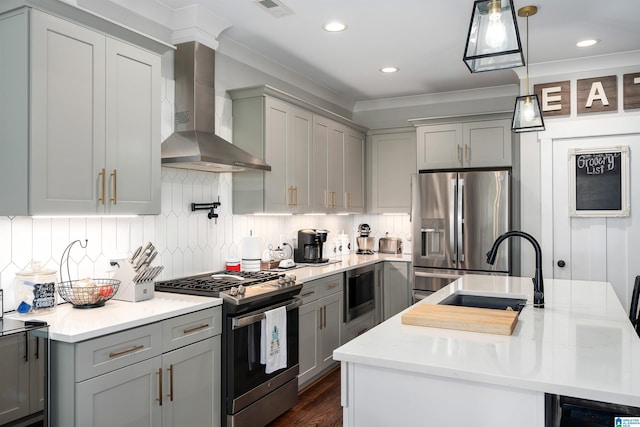 715 W Cassie Dr, Pell City, AL 35128 - kitchen with appliances with stainless steel finishes, wall chimney range hood, gray cabinets, recessed lighting, and ornamental molding