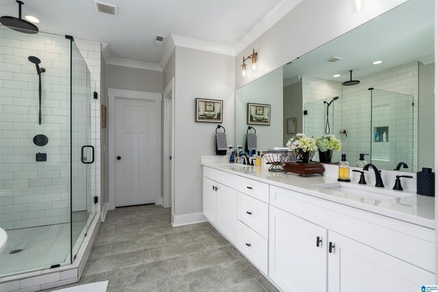 715 W Cassie Dr, Pell City, AL 35128 - bathroom featuring a shower stall, double vanity, ornamental molding, and recessed lighting