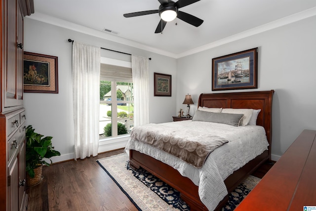 715 W Cassie Dr, Pell City, AL 35128 - bedroom featuring dark wood-type flooring, crown molding, and ceiling fan