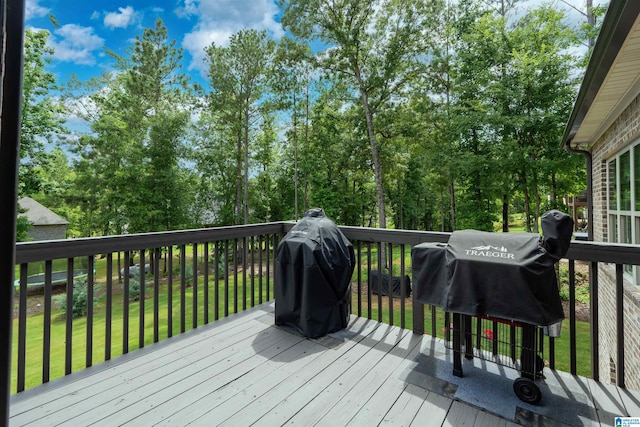 715 W Cassie Dr, Pell City, AL 35128 - wooden deck with a yard and area for grilling