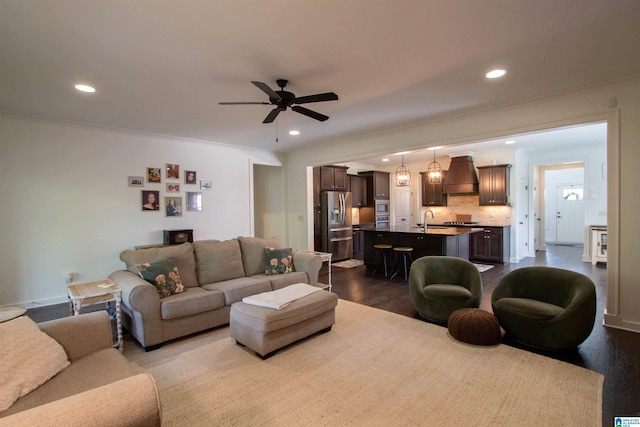 5250 Kate Cv, Trussville, AL 35173 - living room featuring dark wood-style floors, recessed lighting, crown molding, and a ceiling fan