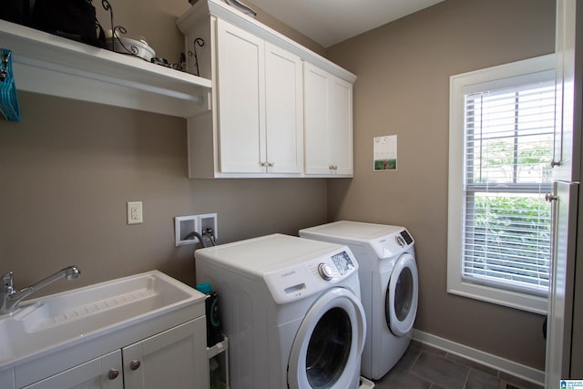 5250 Kate Cv, Trussville, AL 35173 - laundry room with cabinet space, washer and dryer, and dark tile patterned flooring