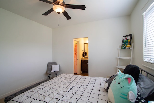 5250 Kate Cv, Trussville, AL 35173 - carpeted bedroom featuring multiple windows, a ceiling fan, and connected bathroom