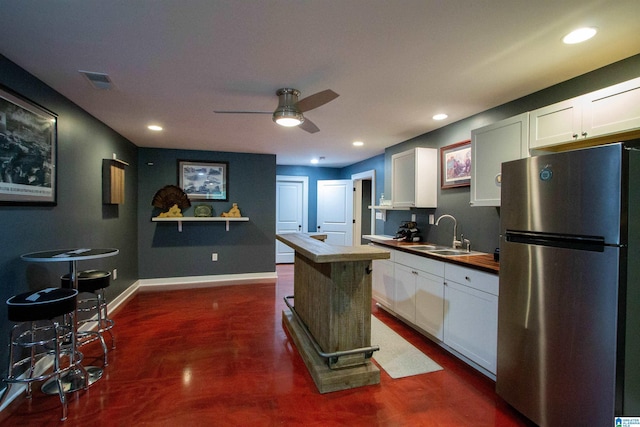 5250 Kate Cv, Trussville, AL 35173 - kitchen featuring freestanding refrigerator, white cabinets, a ceiling fan, dark wood-style floors, and recessed lighting