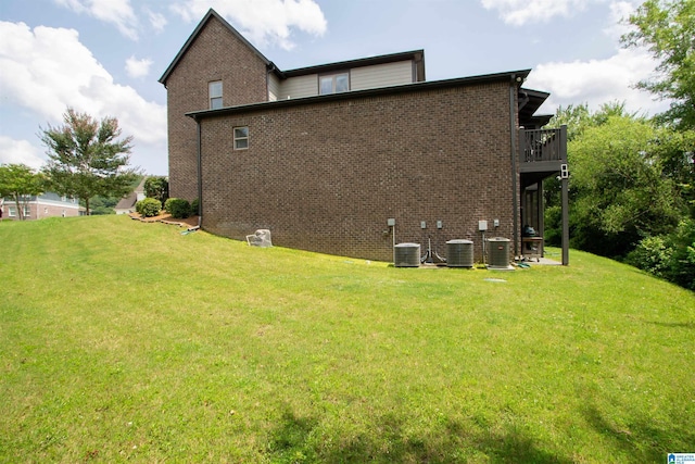 5250 Kate Cv, Trussville, AL 35173 - view of side of property with brick siding, a yard, and a balcony