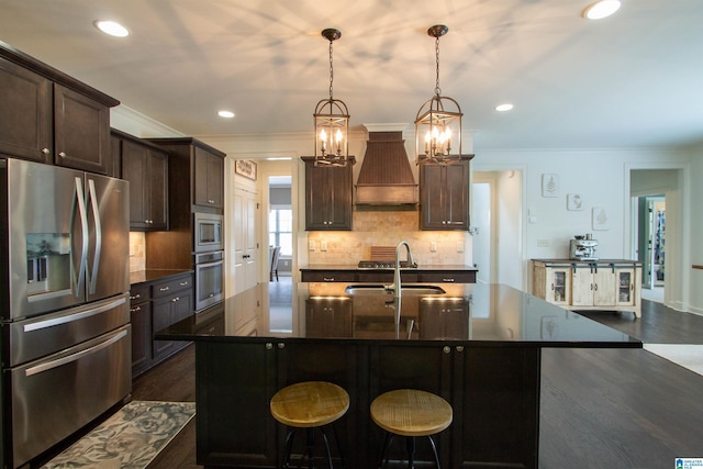 5250 Kate Cv, Trussville, AL 35173 - kitchen featuring stainless steel appliances, custom range hood, dark wood-type flooring, crown molding, and dark brown cabinetry