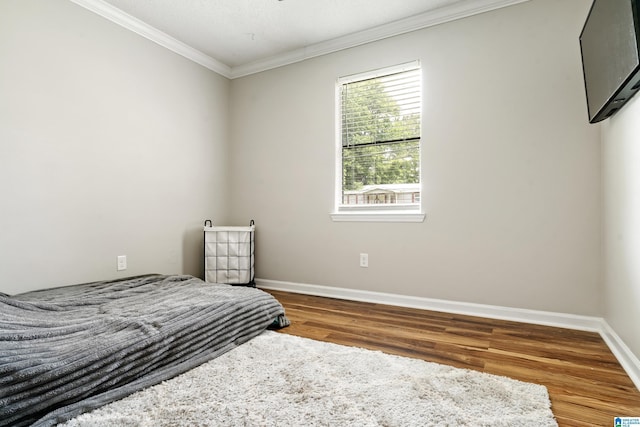 405 Willow Dr, Hueytown, AL 35023 - bedroom featuring wood finished floors and ornamental molding