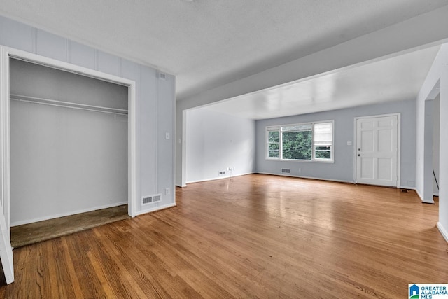 1821 4th St NW, Center Point, AL 35215 - unfurnished bedroom featuring wood finished floors and a closet