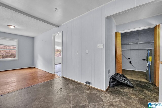 1821 4th St NW, Center Point, AL 35215 - spare room featuring water heater and stone finish floors