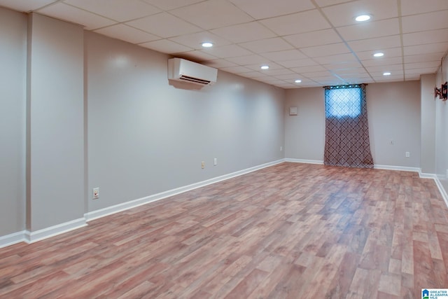 204 Shalimar Cir, Alabaster, AL 35007 - finished below grade area featuring an AC wall unit, light wood-type flooring, a drop ceiling, and recessed lighting
