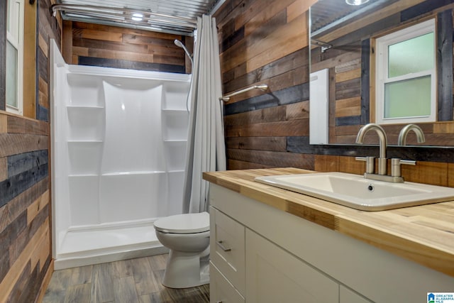 204 Shalimar Cir, Alabaster, AL 35007 - full bath with wood walls, vanity, a shower stall, and wood finished floors