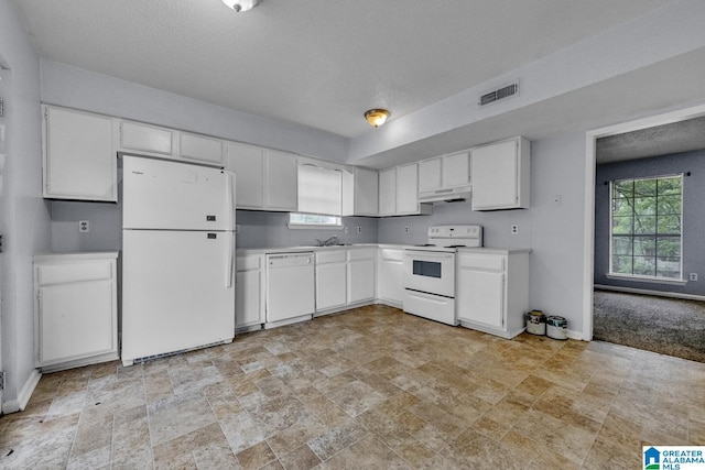 1722 6th Place Cir NW, Center Point, AL 35215 - kitchen with white appliances, under cabinet range hood, light countertops, white cabinetry, and stone finish flooring