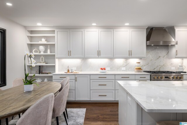 3709 Dover Dr, Mountain Brook, AL 35223 - kitchen featuring wall chimney exhaust hood, open shelves, range, dark wood finished floors, and light stone counters
