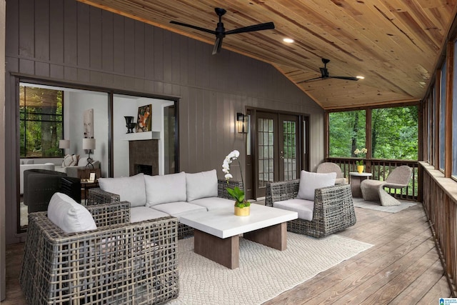 3709 Dover Dr, Mountain Brook, AL 35223 - sunroom with french doors, ceiling fan, an outdoor living space with a fireplace, and lofted ceiling