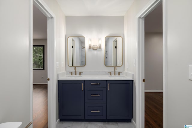 3709 Dover Dr, Mountain Brook, AL 35223 - full bath featuring double vanity and wood finished floors