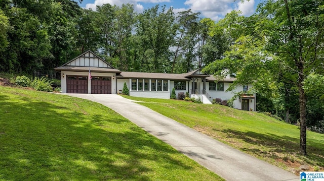 3128 Ryecroft Rd, Mountain Brook, AL 35223 - view of front of house featuring an attached garage, a front yard, and concrete driveway