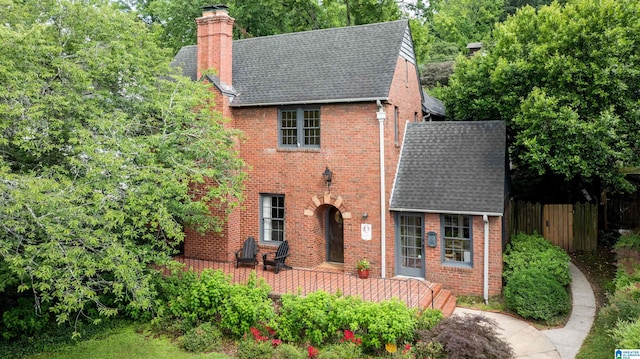 3443 Cliff Rd S, Birmingham, AL 35205 - view of front facade featuring roof with shingles, brick siding, and a chimney