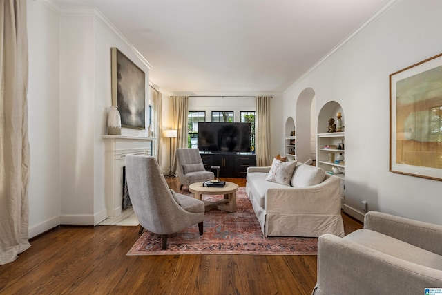3443 Cliff Rd S, Birmingham, AL 35205 - living area featuring wood finished floors, built in shelves, crown molding, and a fireplace