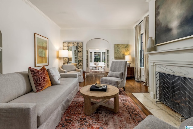 3443 Cliff Rd S, Birmingham, AL 35205 - living area with wood finished floors, arched walkways, crown molding, and a high end fireplace