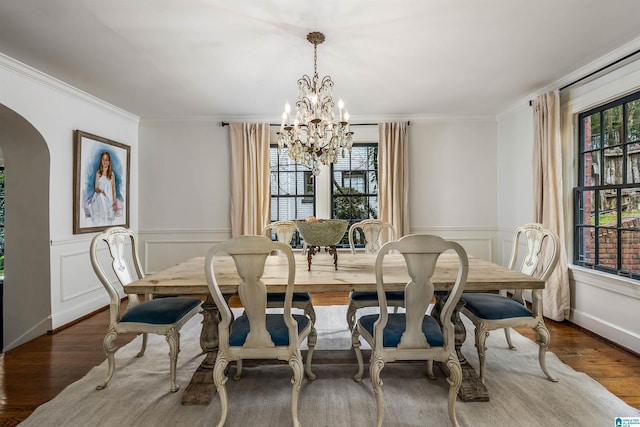 3443 Cliff Rd S, Birmingham, AL 35205 - dining room with a chandelier, plenty of natural light, crown molding, arched walkways, and wainscoting