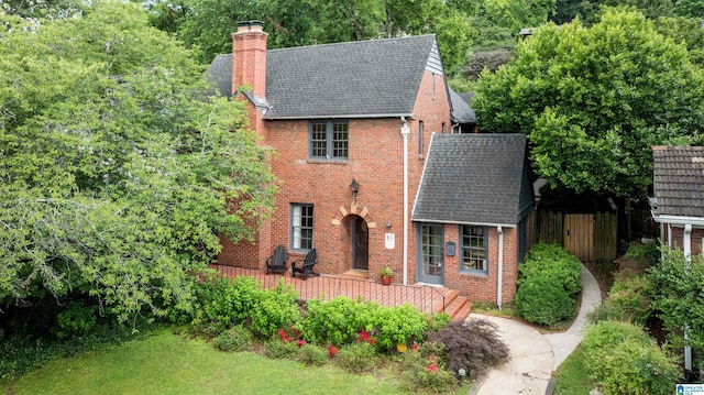 3443 Cliff Rd S, Birmingham, AL 35205 - view of front of home with brick siding, a chimney, and a shingled roof