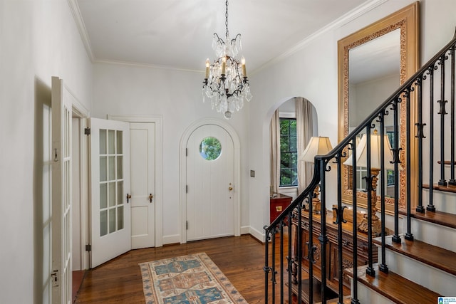 3443 Cliff Rd S, Birmingham, AL 35205 - entryway featuring arched walkways, wood finished floors, stairs, a chandelier, and crown molding