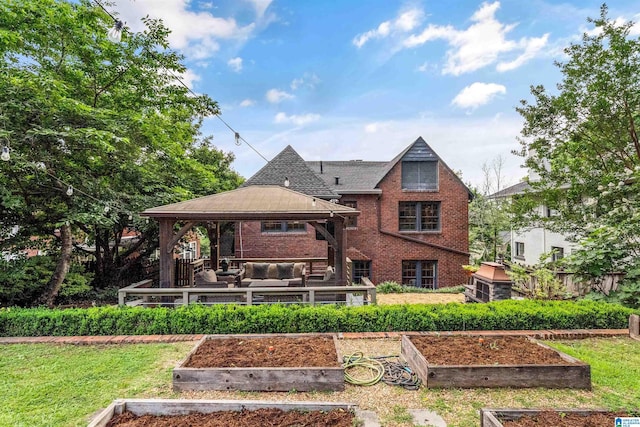 3443 Cliff Rd S, Birmingham, AL 35205 - back of property with a gazebo, a vegetable garden, brick siding, and an outdoor living space