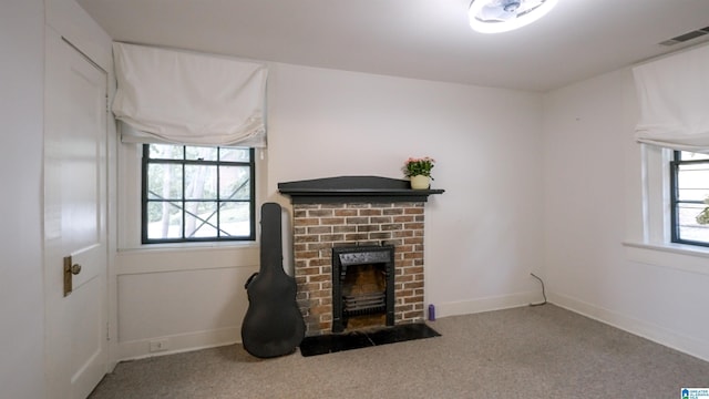 3443 Cliff Rd S, Birmingham, AL 35205 - unfurnished living room with a brick fireplace and carpet floors