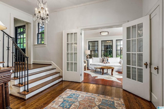 3443 Cliff Rd S, Birmingham, AL 35205 - entryway with stairs, ornamental molding, wood finished floors, a chandelier, and french doors