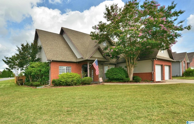 401 Waterford Highlands Way, Calera, AL 35040 - view of front of house featuring brick siding, a front lawn, concrete driveway, and roof with shingles