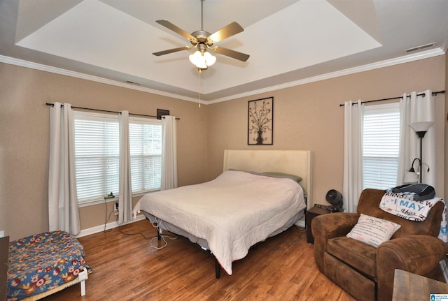 401 Waterford Highlands Way, Calera, AL 35040 - bedroom featuring a tray ceiling, wood finished floors, ornamental molding, and a ceiling fan