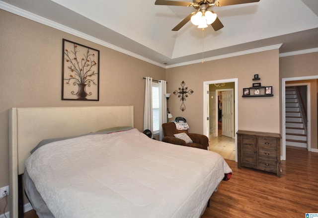 401 Waterford Highlands Way, Calera, AL 35040 - bedroom with wood finished floors, ornamental molding, a raised ceiling, and a ceiling fan