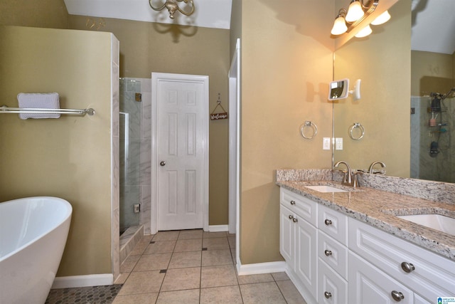 401 Waterford Highlands Way, Calera, AL 35040 - full bathroom featuring double vanity, a freestanding bath, a stall shower, tile patterned floors, and a chandelier