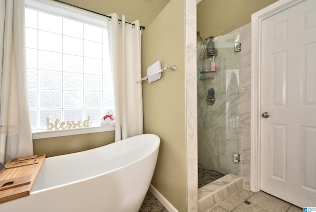 401 Waterford Highlands Way, Calera, AL 35040 - bathroom with plenty of natural light, a stall shower, a freestanding tub, and tile patterned floors