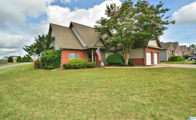 401 Waterford Highlands Way, Calera, AL 35040 - obstructed view of property featuring brick siding, driveway, a front yard, and roof with shingles