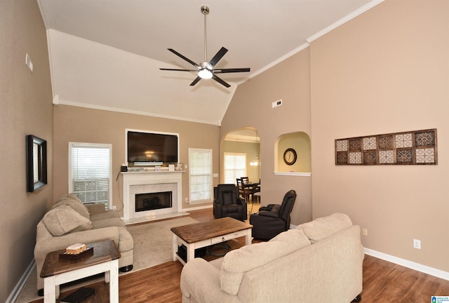 401 Waterford Highlands Way, Calera, AL 35040 - living area featuring arched walkways, a ceiling fan, dark wood finished floors, ornamental molding, and a fireplace