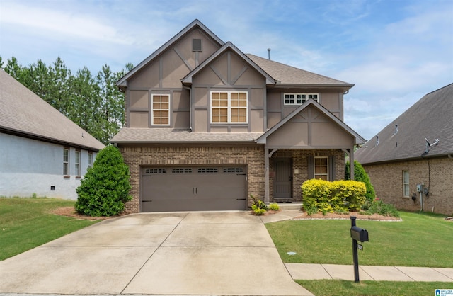 1221 Grants Way, Irondale, AL 35210 - english style home with stucco siding, brick siding, an attached garage, and a front lawn