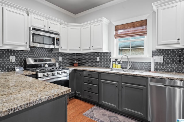 1221 Grants Way, Irondale, AL 35210 - kitchen featuring stainless steel appliances, gray cabinetry, white cabinetry, and ornamental molding