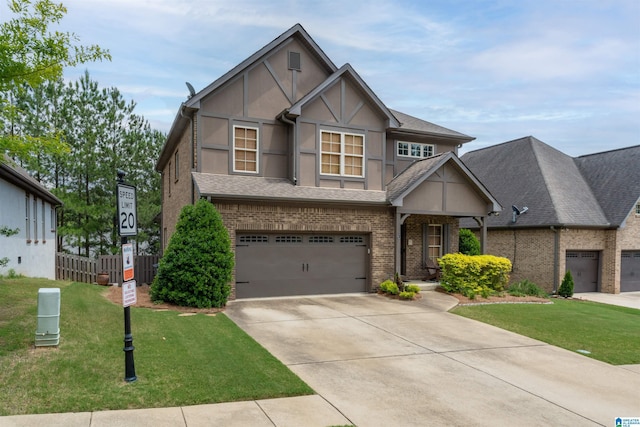 1221 Grants Way, Irondale, AL 35210 - tudor home featuring driveway, an attached garage, brick siding, and stucco siding