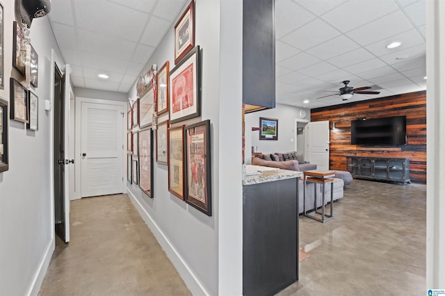 1221 Grants Way, Irondale, AL 35210 - hall with a paneled ceiling, finished concrete flooring, recessed lighting, wooden walls, and an accent wall