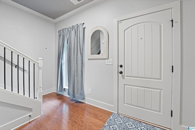 1221 Grants Way, Irondale, AL 35210 - foyer entrance with wood finished floors, ornamental molding, and stairs